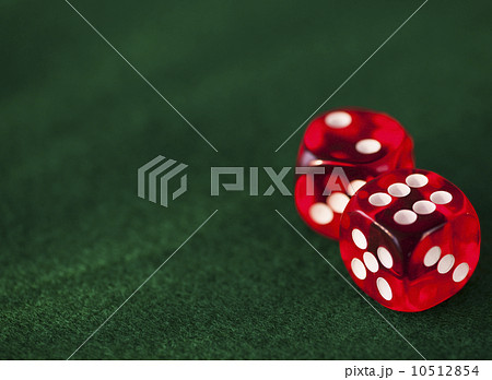 Close up of red dices on green felt Close up of red dices on green felt 10512854