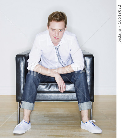 Portrait of man sitting in armchair Portrait of man sitting in armchair 10513022