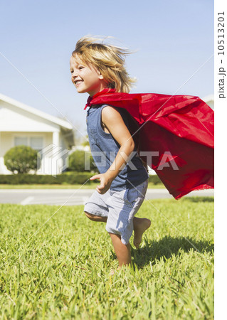 Boy (4-5) running with cape Boy (4-5) running with cape 10513201