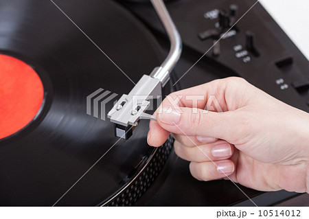 placing the needle on a record 10514012