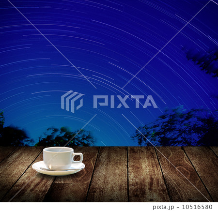 Drink coffee cup with star trails background 10516580