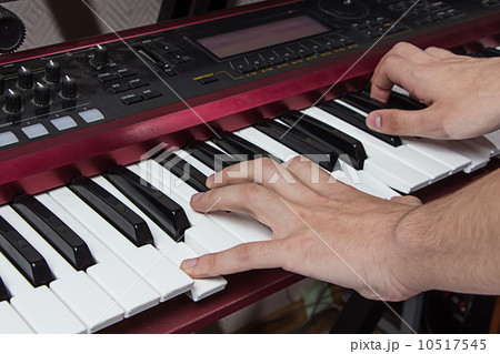 Man playing synthesizer 10517545