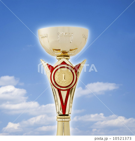 Gold champions trophy over a blue sky Gold champions trophy over a blue sky 10521373