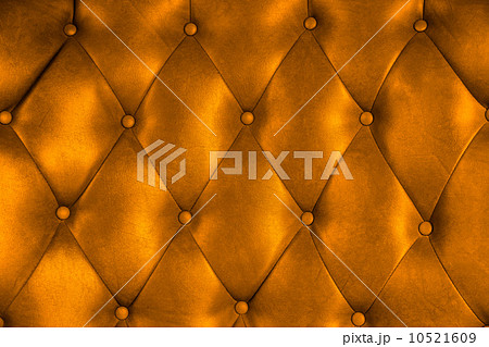 Luxury upholstery leather button chair texture in orange Luxury upholstery leather button chair texture in orange 10521609