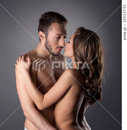 Passionate nude lovers embracing in studio Passionate nude lovers embracing in studio 10524745