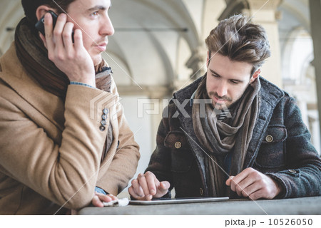two young handsome businessmen using tablet 10526050