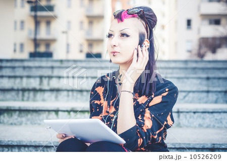 young beautiful punk dark girl listening music 10526209