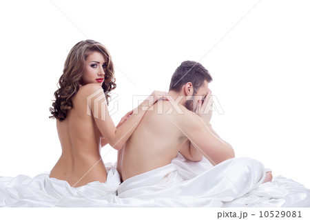 Distressed man with beautiful naked girl in bed 10529081