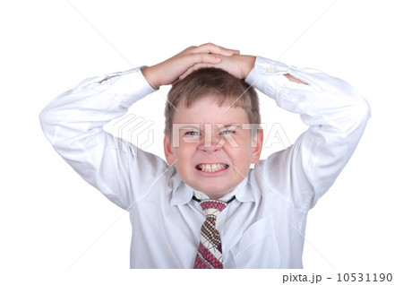 The boy is angry has put hands on a head 10531190