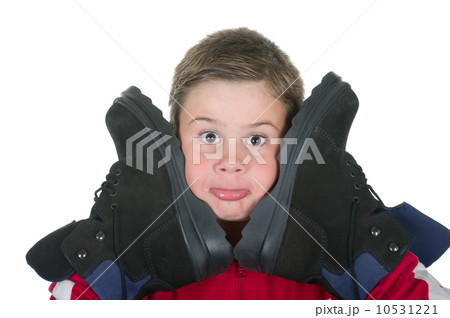 Boy presses boots to the person Boy presses boots to the person 10531221