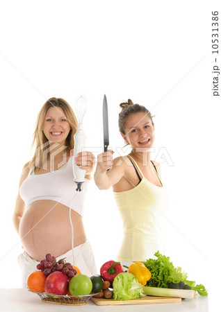 happy woman with fruit, blender and a knife happy woman with fruit, blender and a knife 10531386