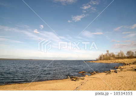 Sandy beach on lake in sunny spring day  10534355
