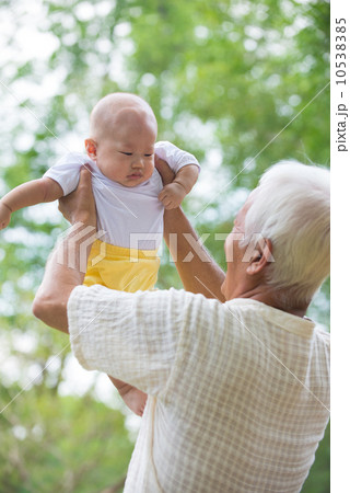 asian grandfather having fun with his son outdoor asian grandfather having fun with his son outdoor 10538385