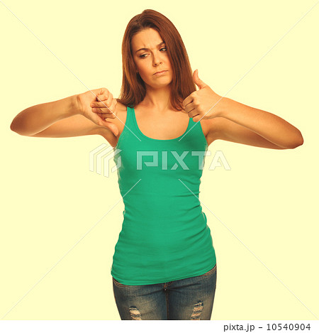 girl woman in a green shirt shows signs of yes and no, hand fing 10540904