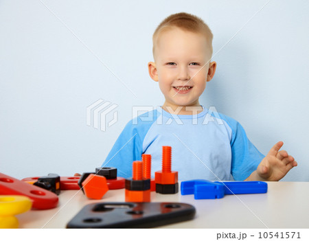 Happy child playing with toys Happy child playing with toys 10541571