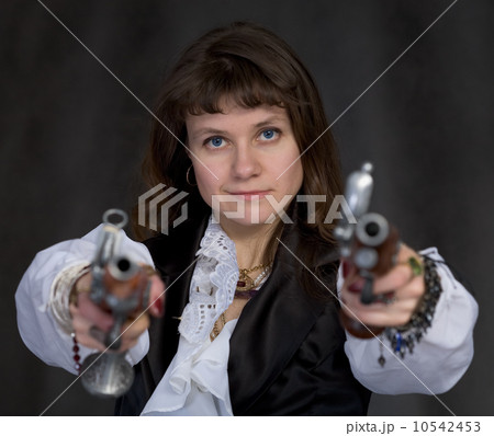 Girl - pirate with two ancient pistols in hands Girl - pirate with two ancient pistols in hands 10542453