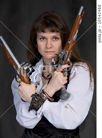 Girl - pirate with two ancient pistols in hands Girl - pirate with two ancient pistols in hands 10542468