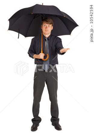 Person protected by a large umbrella 10542594