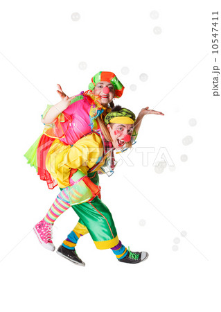 Two cheerful clowns in the soap bubbles isolated on a white background 10547411