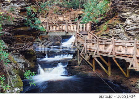 Autumn creek with hiking trails and foliage 10551434