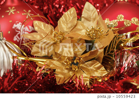 Red christmas balls and decorations on red 10559423