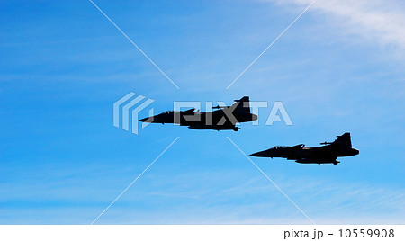Two aircraft Jas 39 Gripen on blue sky Two aircraft Jas 39 Gripen on blue sky 10559908