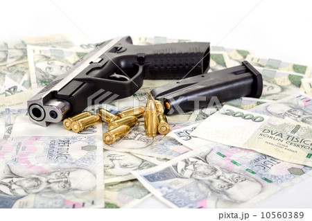 gun with bullet on czech banknotes 10560389