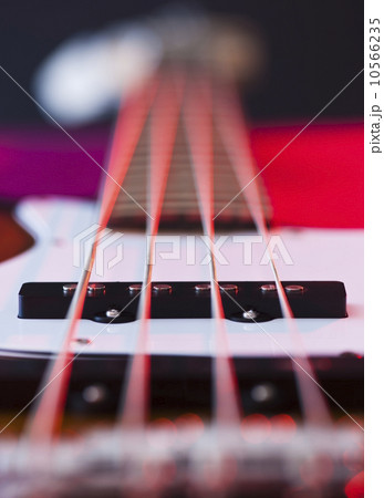 Close up of strings of bass guitar Close up of strings of bass guitar 10566235