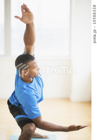 Young man practicing yoga Young man practicing yoga 10566338