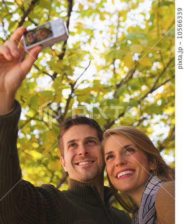 Young couple walking on pavement 10566339