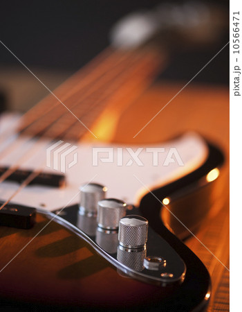 Close up of volume knobs of bass guitar Close up of volume knobs of bass guitar 10566471