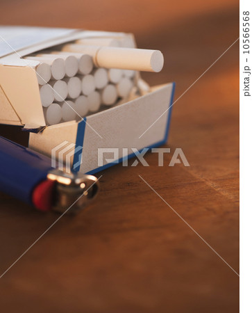 Close up of open cigarette pack and lighter 10566568