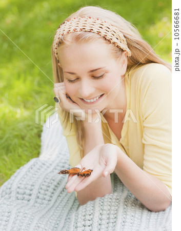 Woman holding butterfly on hand 10566681