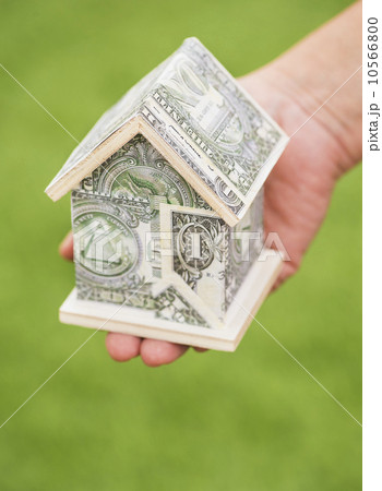 Studio Shot of house made from dollar bills Studio Shot of house made from dollar bills 10566800