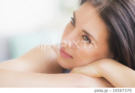 Portrait of woman relaxing on sofa Portrait of woman relaxing on sofa 10567370