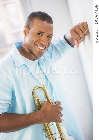 Young man holding trumpet 10567496