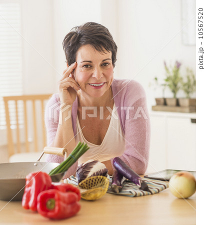 Portrait of mature woman in kitchen Portrait of mature woman in kitchen 10567520