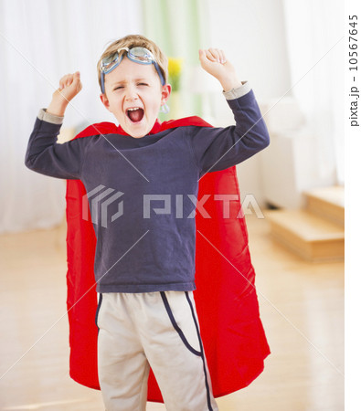 Portrait of boy (6-7) wearing superhero costume 10567645