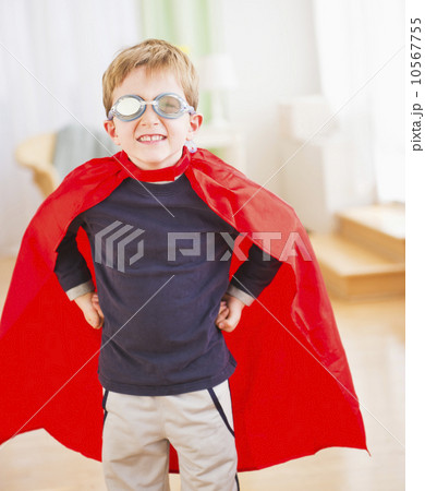 Portrait of boy (6-7) wearing superhero costume 10567755