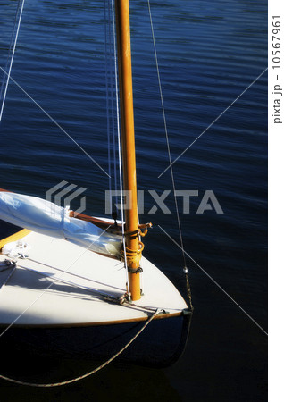 Yacht with furled sail Yacht with furled sail 10567961