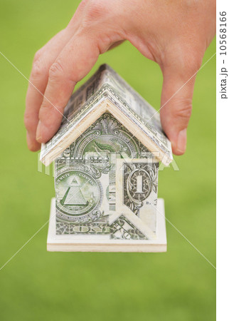 Studio Shot of house made from dollar bills Studio Shot of house made from dollar bills 10568166