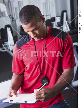 Athletic young man in gym 10568333
