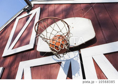 Basketball outside barn 10568385