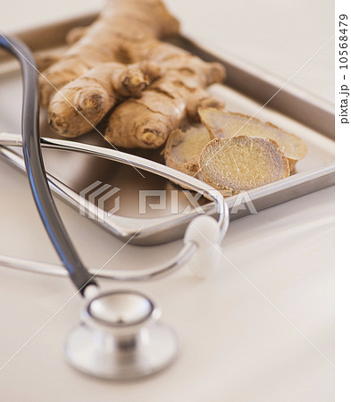 Close up of ginger root and stethoscope Close up of ginger root and stethoscope 10568479