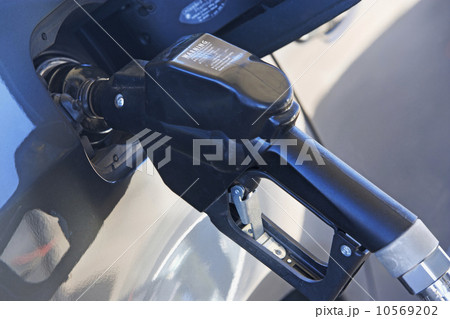 pumping gas in a car pumping gas in a car 10569202