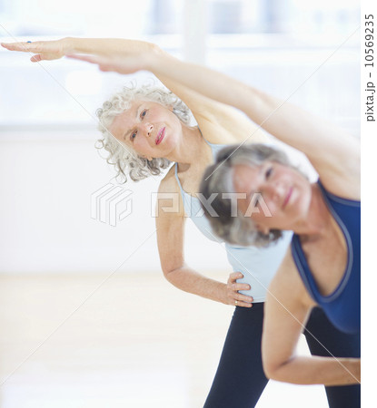 Two senior women stretching 10569235