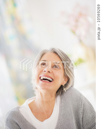 Portrait of woman relaxing on sofa Portrait of woman relaxing on sofa 10569269
