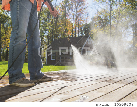 Man cleaning porch 10569605