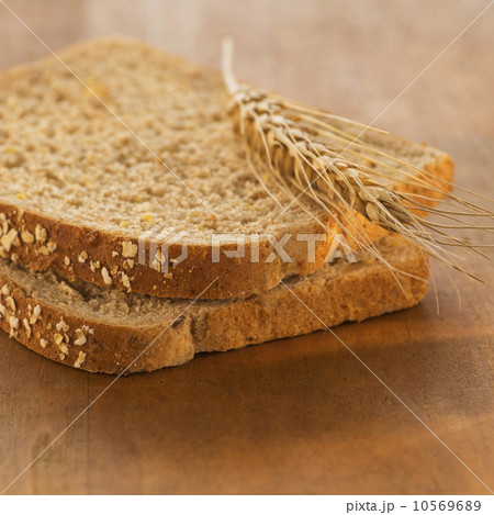 Studio Shot of slices of bread with wheat Studio Shot of slices of bread with wheat 10569689