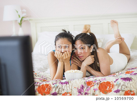 Two women watching tv 10569700